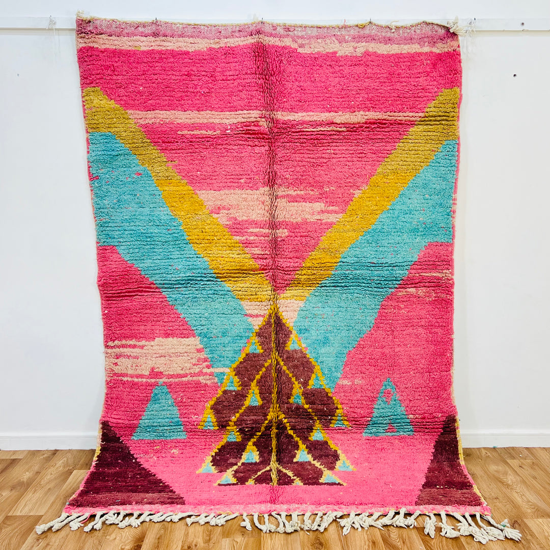 Vintage Moroccan rug with pink, aqua, and yellow triangle patterns, handwoven wool. Traditional Berber design, 239x170 cm.