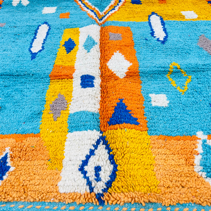 Blue and orange Moroccan Berber rug with diamond pattern, handmade with 100% wool. Ideal as a vintage-style area rug.
