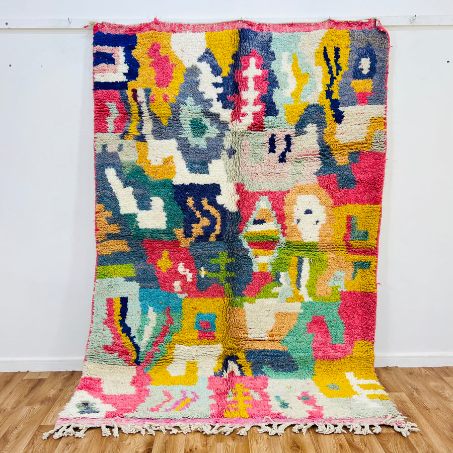 Vibrant handmade Moroccan rug with colorful abstract design, ideal for boho decor. Woolen, 7.9 x 5.4 ft, Moroccan style carpet.