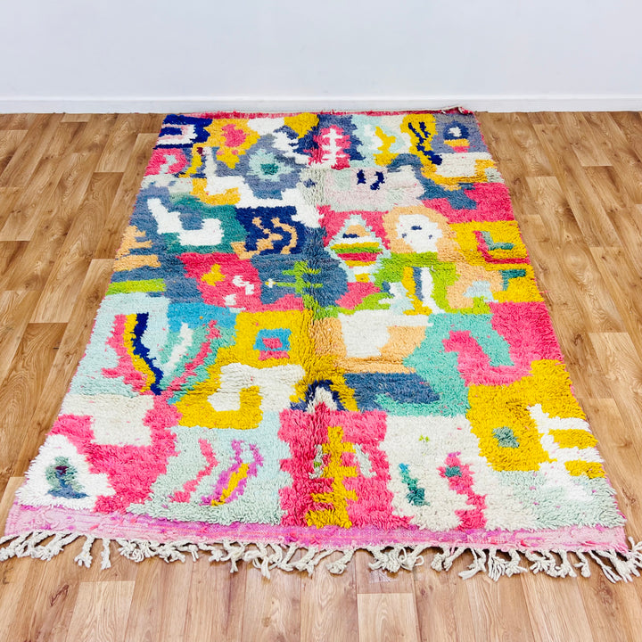Colorful Abstract Moroccan Rug 7.9 x 5.4 ft, handmade with vibrant colors and traditional Berber designs, ideal for boho interiors.
