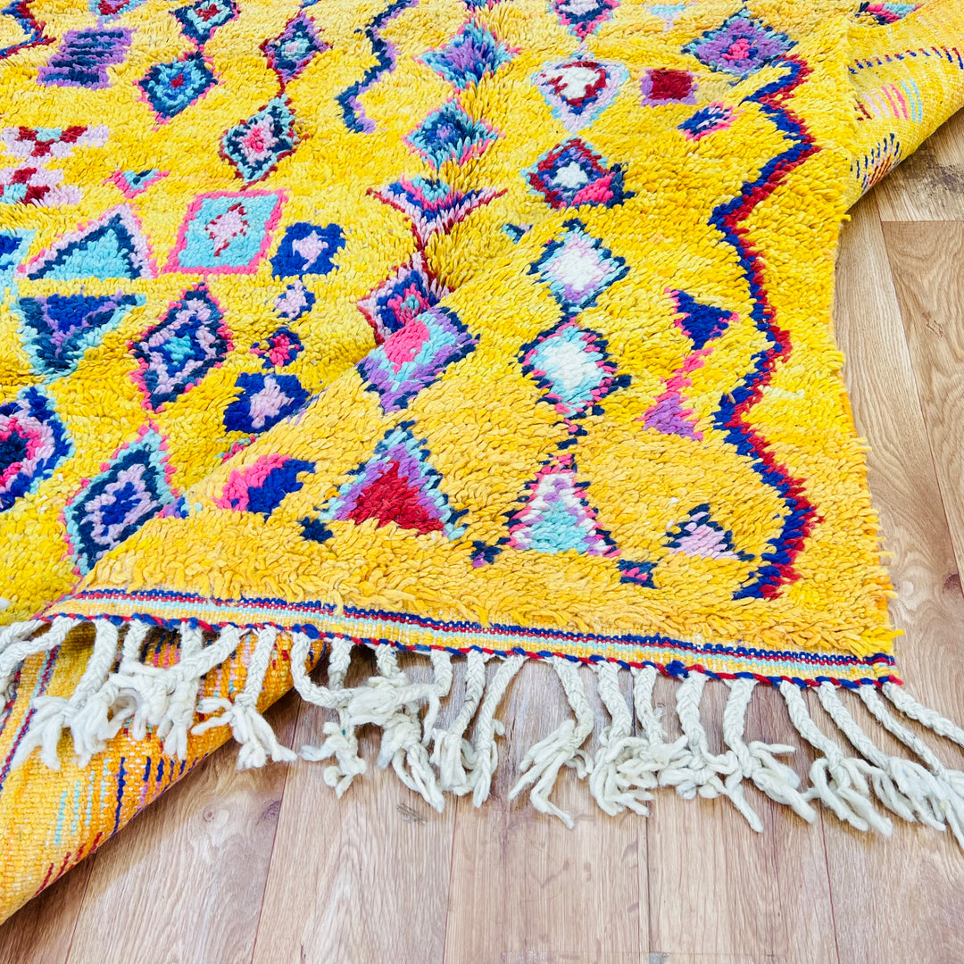 Yellow Moroccan Berber rug with colorful geometric and tribal symbols, 254 x 157 cm, ideal for brightening up home decor.