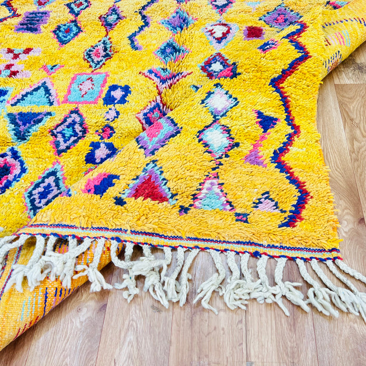 Yellow Moroccan Berber rug with colorful geometric and tribal symbols, 254 x 157 cm, ideal for brightening up home decor.