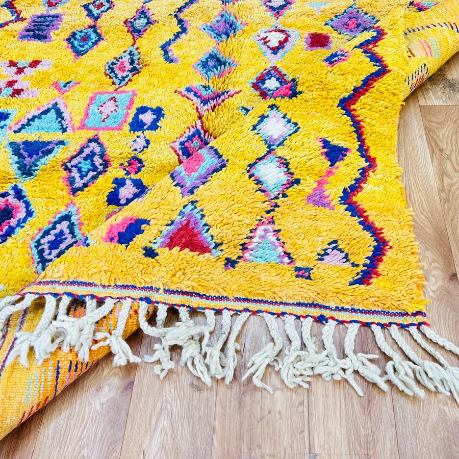 Yellow Moroccan Berber rug with colorful geometric and tribal symbols, 254 x 157 cm, ideal for brightening up home decor.