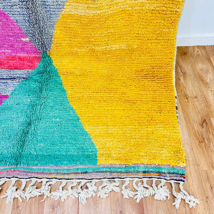 Rare vintage Moroccan rug with bold abstract design in orange, pink, yellow, and mint green. Handwoven 100% wool by Berber artisans.