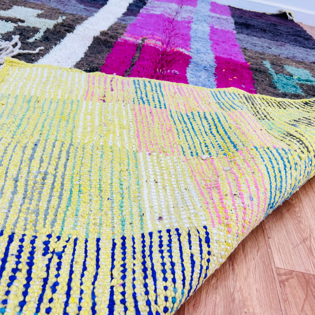 Colorful abstract vintage Moroccan rug with geometric shapes and vibrant colors, showcasing traditional Berber craftsmanship.