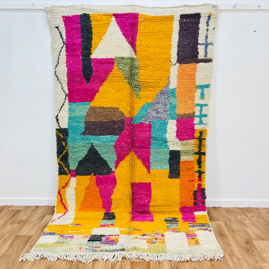 Vintage Moroccan rug with abstract design in magenta, mustard yellow, teal, and orange, handcrafted by Berber artisans.