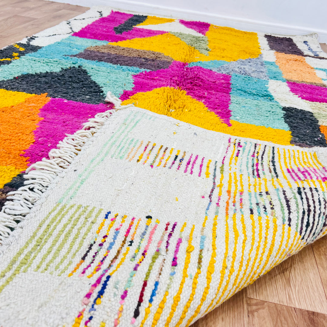 Vintage Moroccan rug with vibrant magenta, mustard, teal patterns, handwoven by Berber women. 8.56 x 5.02 ft.