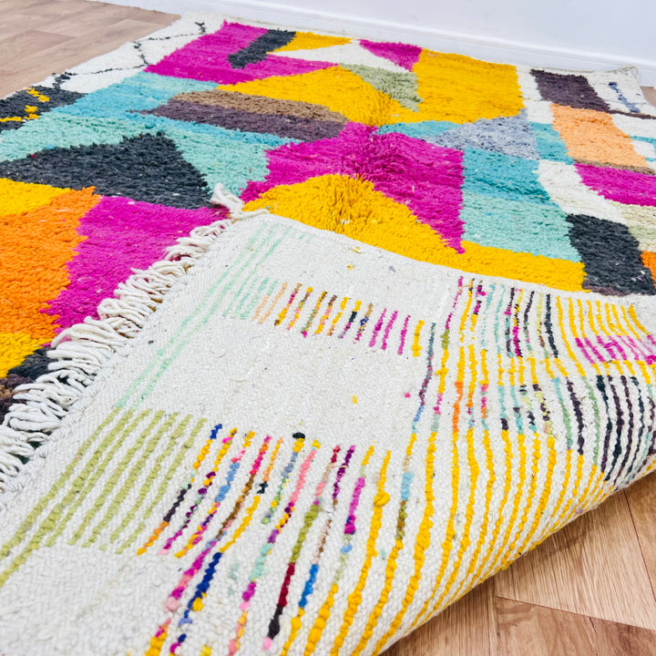 Vintage Moroccan rug with vibrant magenta, mustard, teal patterns, handwoven by Berber women. 8.56 x 5.02 ft.