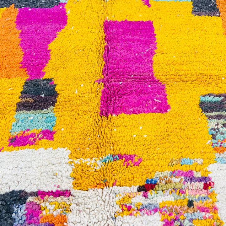 Vintage Moroccan Berber rug with vibrant magenta and mustard yellow abstract design, handwoven in the Atlas Mountains. Size: 8.56 x 5.02 ft.