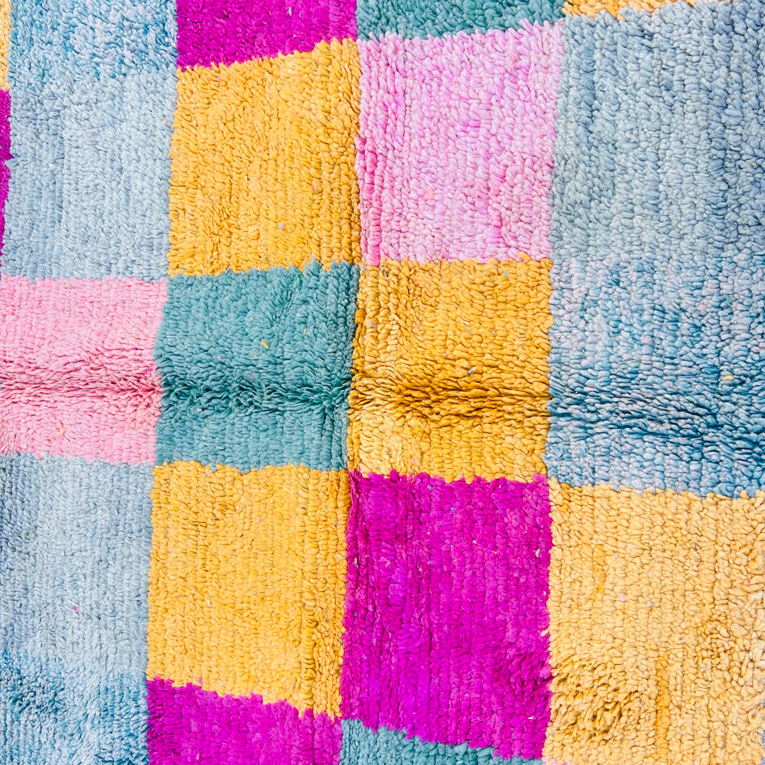 Vintage Moroccan rug with vibrant color blocks of pink, mustard, sage, and grey, handwoven by Berber artisans, perfect for eclectic interiors.