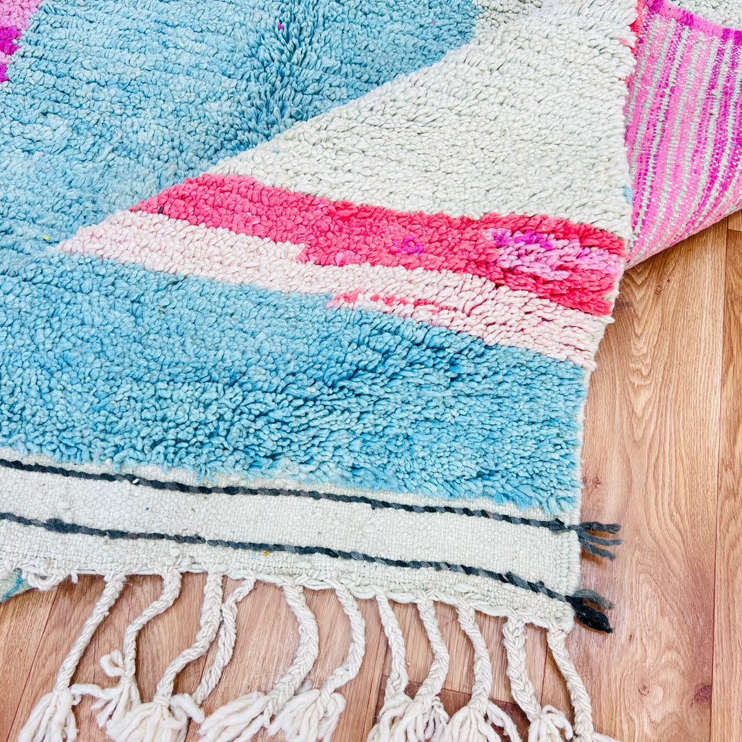 Abstract pink and aqua Moroccan Berber rug, handmade with natural wool, showcasing bold black shapes, size 8x5 ft.