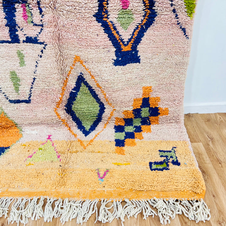 Vintage Moroccan Berber rug with colorful diamond motifs, handwoven wool, 248x150 cm, traditional tribal design, soft peach base.