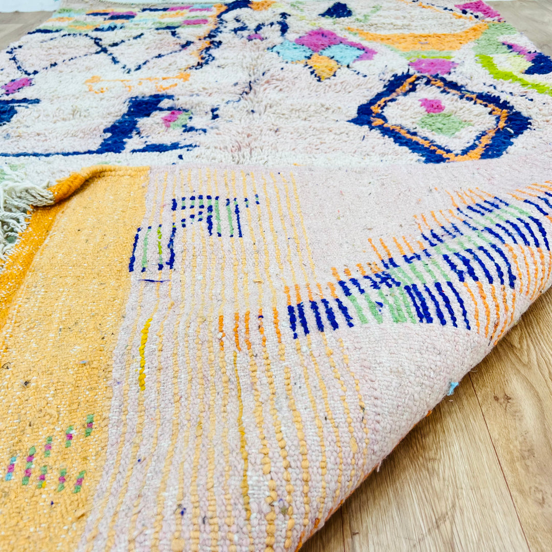 Colorful tribal diamond Moroccan rug with handwoven Berber symbols, 248x150 cm, adds vibrant charm to any space.