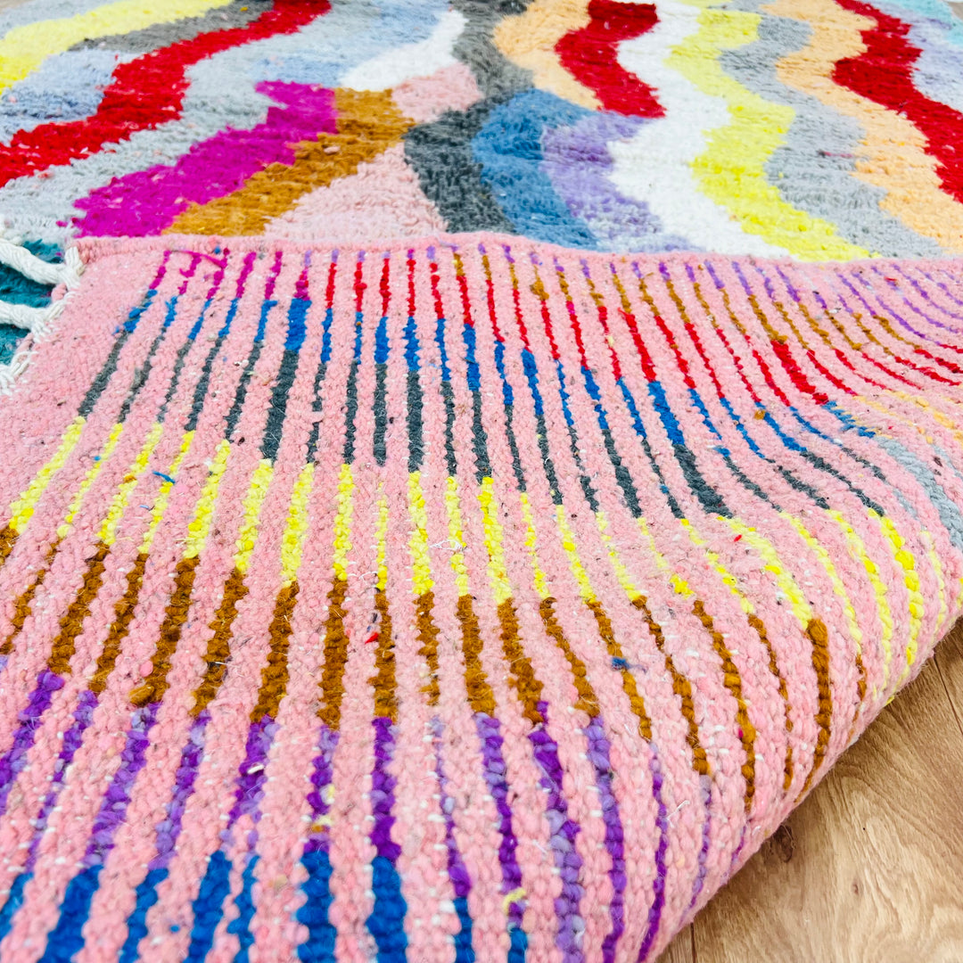 Vintage Moroccan rug with colorful wave pattern in red, pink, teal, mustard, black. Handmade by Berber artisans. 8.4 x 5.1 ft