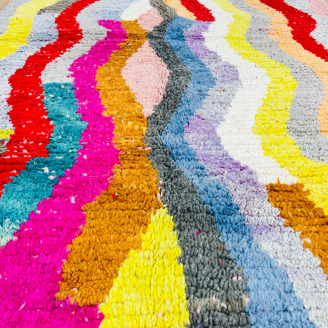 Vintage Moroccan rug with colorful wave pattern in red, pink, teal, mustard, cream, by Berber artisans. Moroccan rugs for sale.