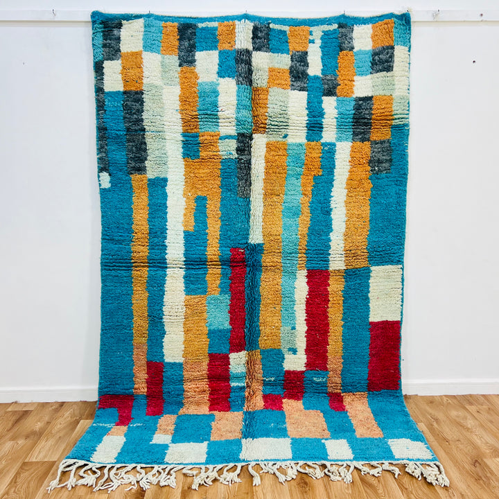 Vintage Moroccan Berber rug with turquoise, ochre, red, and charcoal geometric design; handwoven wool, size 207x161 cm.