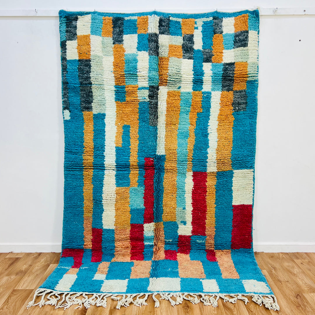 Vintage Moroccan Rug 431 with vibrant turquoise, ochre, and red geometric designs, handwoven by Berber artisans. Size 207x161 cm.