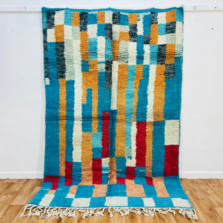 Vintage Moroccan Rug 431 with vibrant turquoise, ochre, and red geometric designs, handwoven by Berber artisans. Size 207x161 cm.