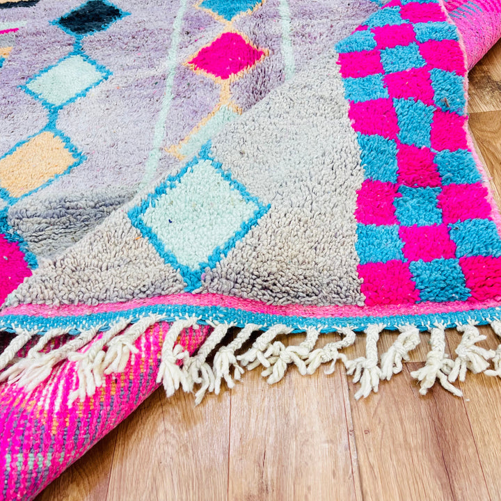 Vintage Moroccan rug with checker and diamond pattern in pink, blue, and ochre; handmade Berber carpet from the Atlas Mountains.