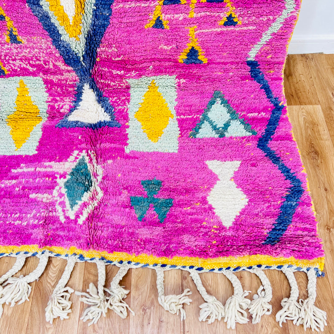 Pink Moroccan rug with tribal diamond and tree motifs, handwoven wool, 164x155 cm, vibrant colors by Berber artisans.