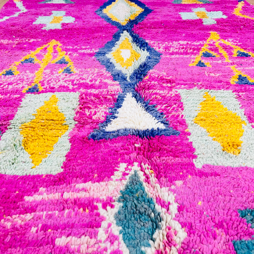 Pink Moroccan Berber rug with tribal symbols in mustard, teal, and navy. Vibrant wool area rug, 164x155 cm. Traditional Moroccan style.