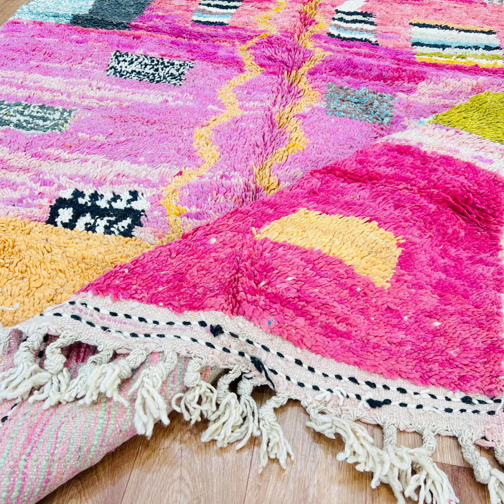 Pink abstract Moroccan rug with vivid colors and block accents, handwoven by Berber artisans. Size 245 x 162 cm.