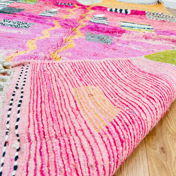 Pink abstract Moroccan rug with vibrant block accents and plush texture, handwoven by Berber artisans. Size: 245 x 162 cm.