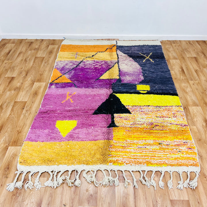 Vintage Moroccan sunset rug in vibrant colors, handmade with symbolic desert patterns. Perfect as a unique area rug or Moroccan carpet.