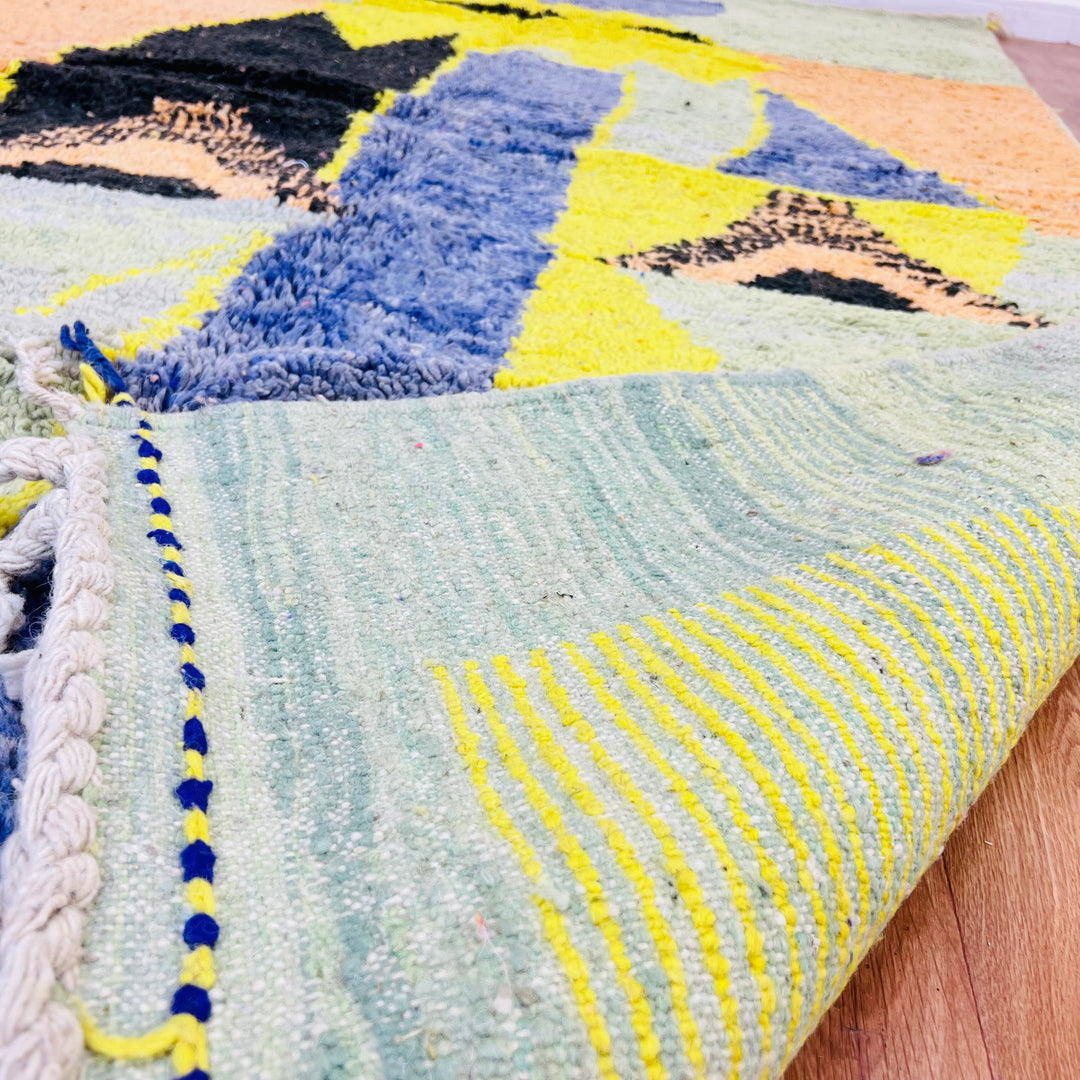 Yellow tribal abstract Moroccan wool rug with geometric designs in indigo and olive, 275x168 cm, handmade Berber style.
