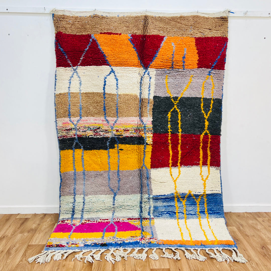 Vintage Moroccan Wool Rug 1003 – handmade colorful geometric Moroccan rug in red, yellow, blue, and cream tones (244 × 168 cm).