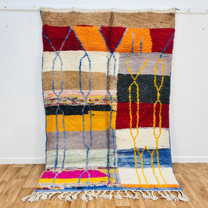 Vintage Moroccan Wool Rug 1003 – handmade colorful geometric Moroccan rug in red, yellow, blue, and cream tones (244 × 168 cm).