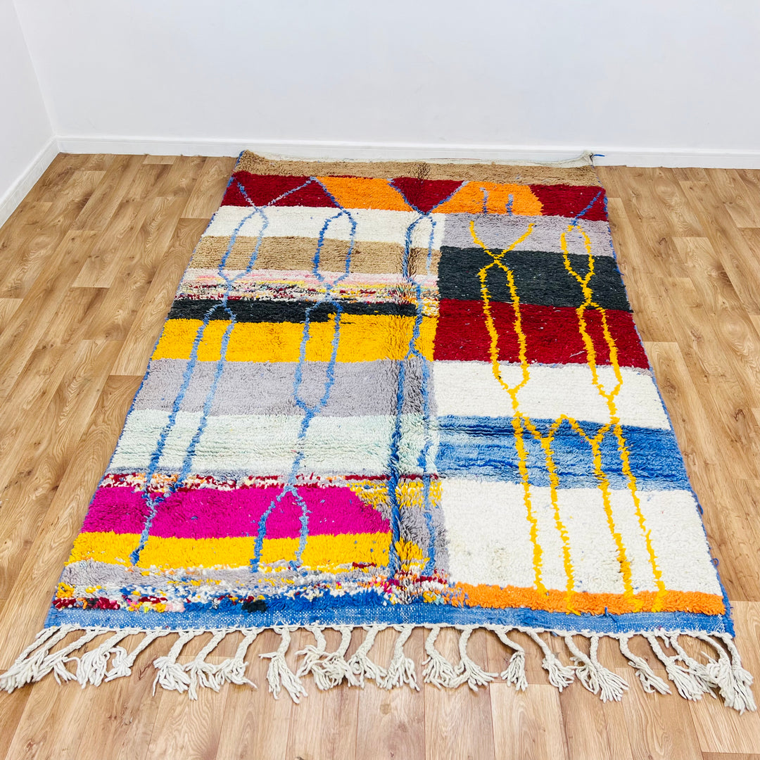 Vintage Moroccan Wool Rug 1003 – handmade colorful geometric Moroccan rug in red, yellow, blue, and cream tones (244 × 168 cm).