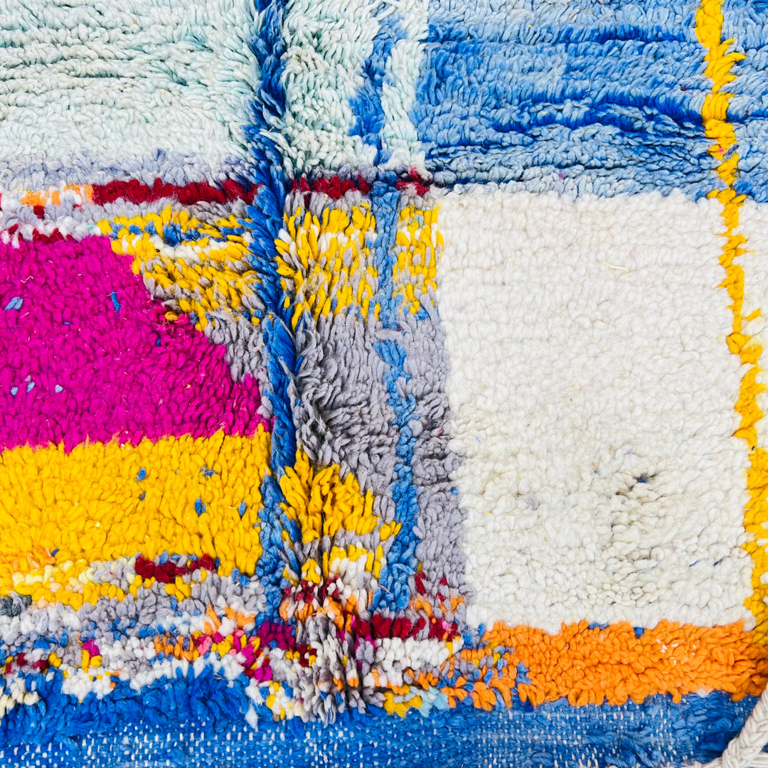 Vintage Moroccan Wool Rug 1003 – handmade colorful geometric Moroccan rug in red, yellow, blue, and cream tones (244 × 168 cm).
