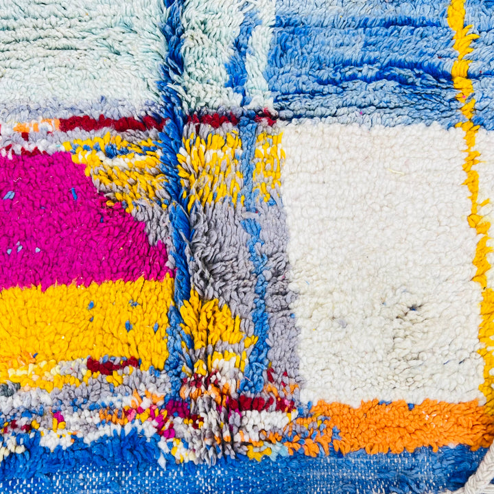 Vintage Moroccan Wool Rug 1003 – handmade colorful geometric Moroccan rug in red, yellow, blue, and cream tones (244 × 168 cm).