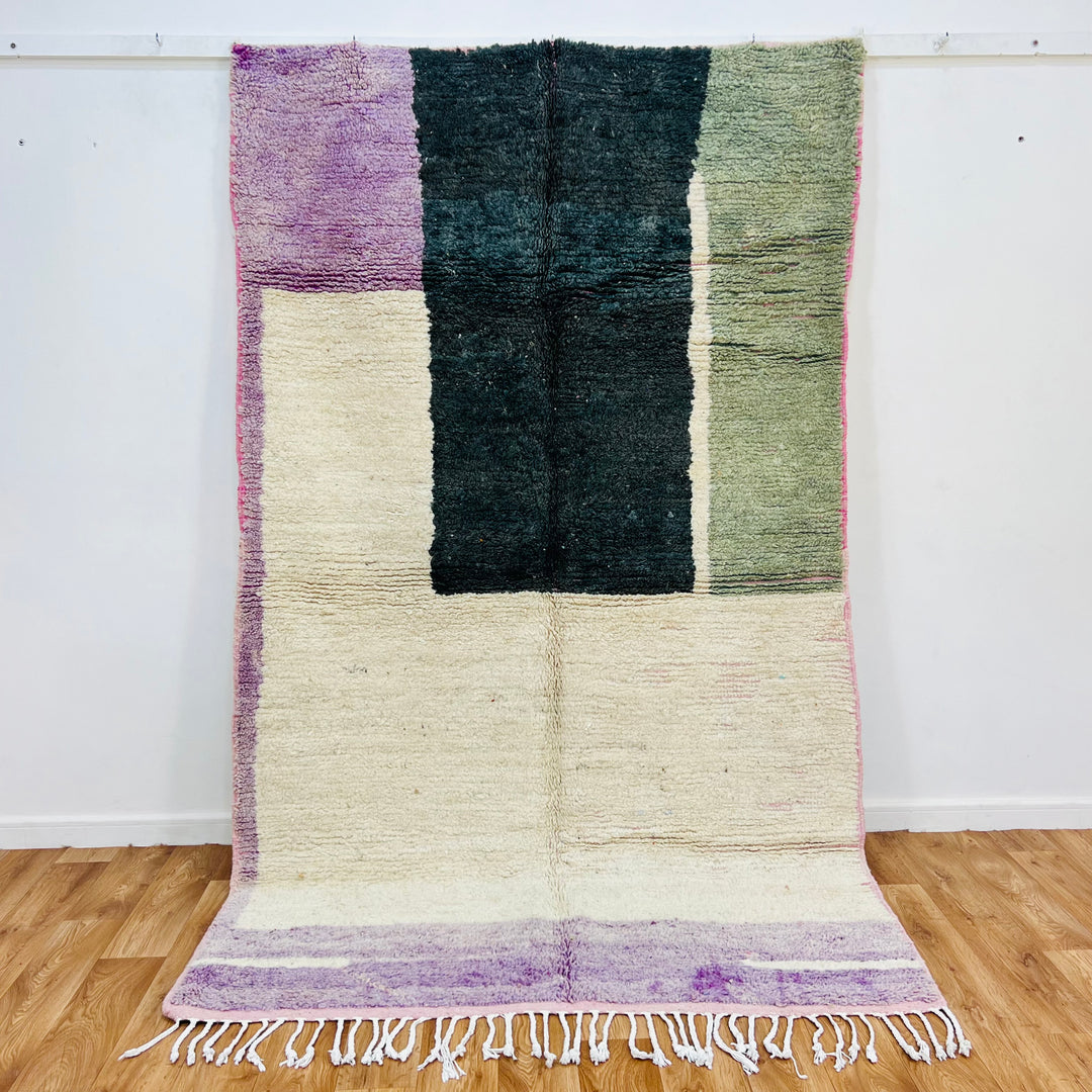 Modern geometric Moroccan rug 259x154 cm with colorful blocks of forest green, sage, and purple tones, perfect for boho interiors.