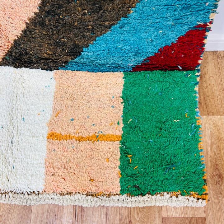 Vintage Moroccan rug with vibrant color blocks of red, green, blue, and ivory, handwoven by Berber women, 258x144 cm.