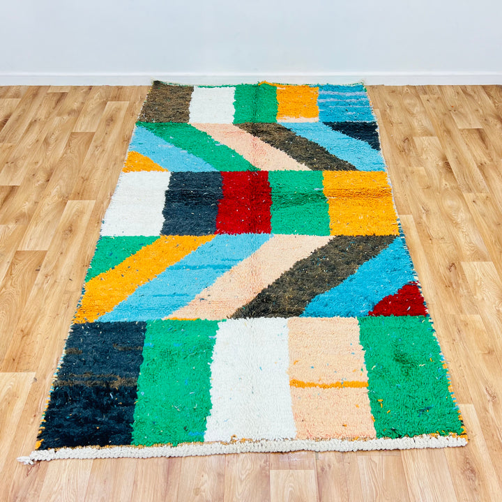 Color block vintage Moroccan rug with vibrant geometric patterns, 258x144 cm, handmade by Berber women, available for sale.