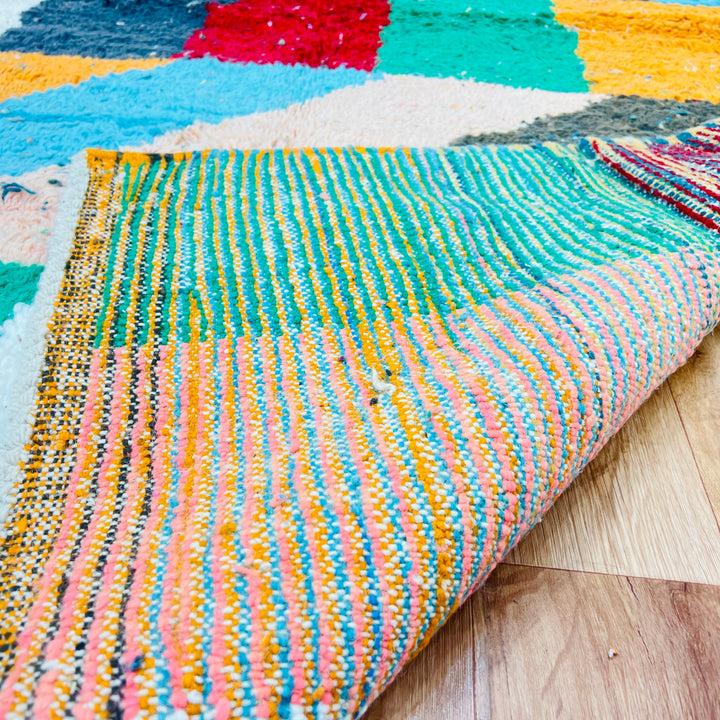 Color block vintage Moroccan rug with red, green, orange, blue, and ivory patterns, handwoven by Berber women. Moroccan rug 258x144 cm.