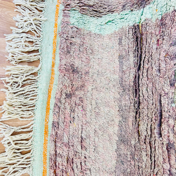 Abstract Moroccan wool rug with sand brown hues and plush texture, showcasing unique artistry and traditional craftsmanship details.