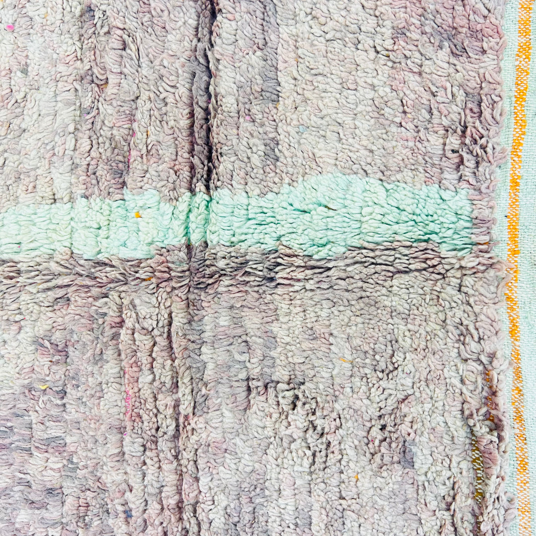 Abstract wool Moroccan rug with earth tones and blue-green accents, showcasing traditional craftsmanship, measuring 229x160 cm.