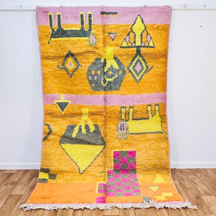 Vintage Moroccan Berber rug with orange base, pink and yellow geometric patterns, handcrafted by Berber artisans, 251x157cm.