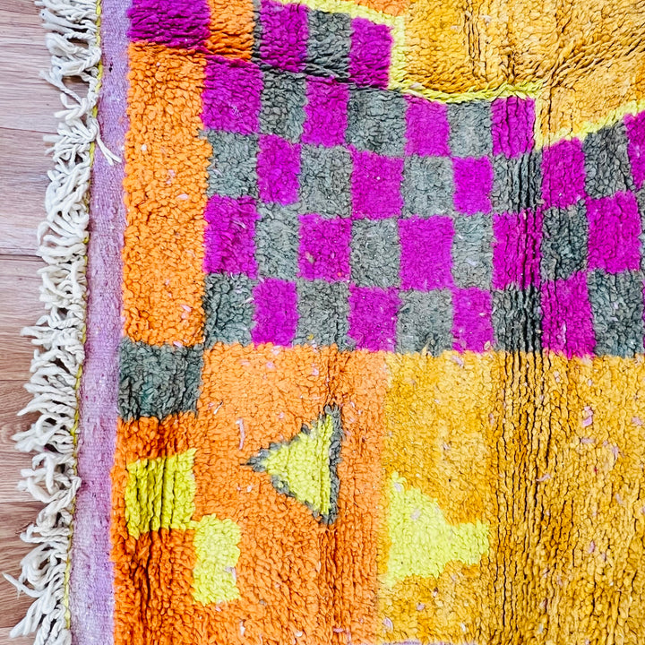 Orange Moroccan Berber rug with pink, yellow symbols and checkerboard pattern, handcrafted by Berber artisans, 251x157 cm.