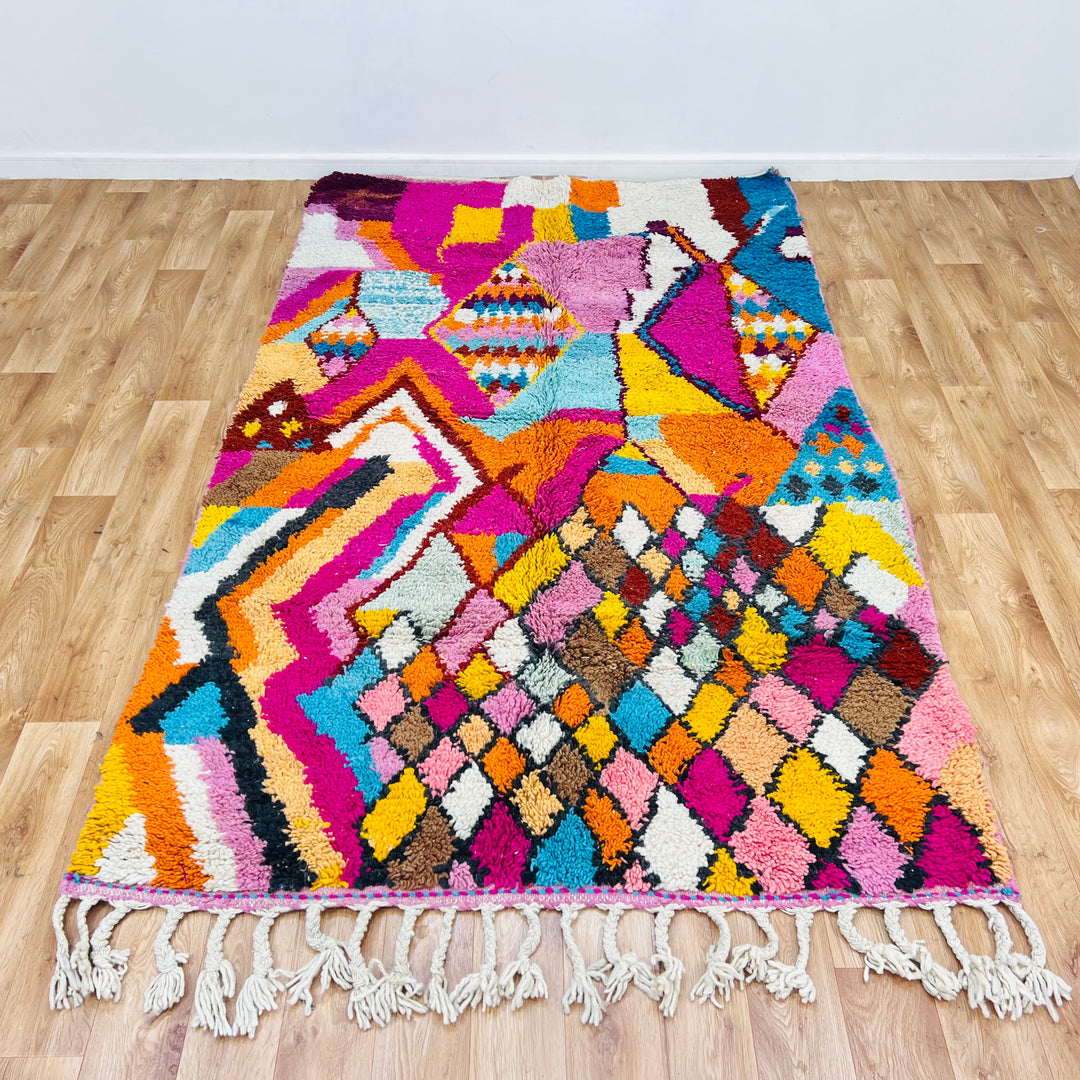 Colorful Moroccan Berber Rug, 255x155 cm, handwoven with vibrant pink, orange, turquoise patterns, traditional shag style.