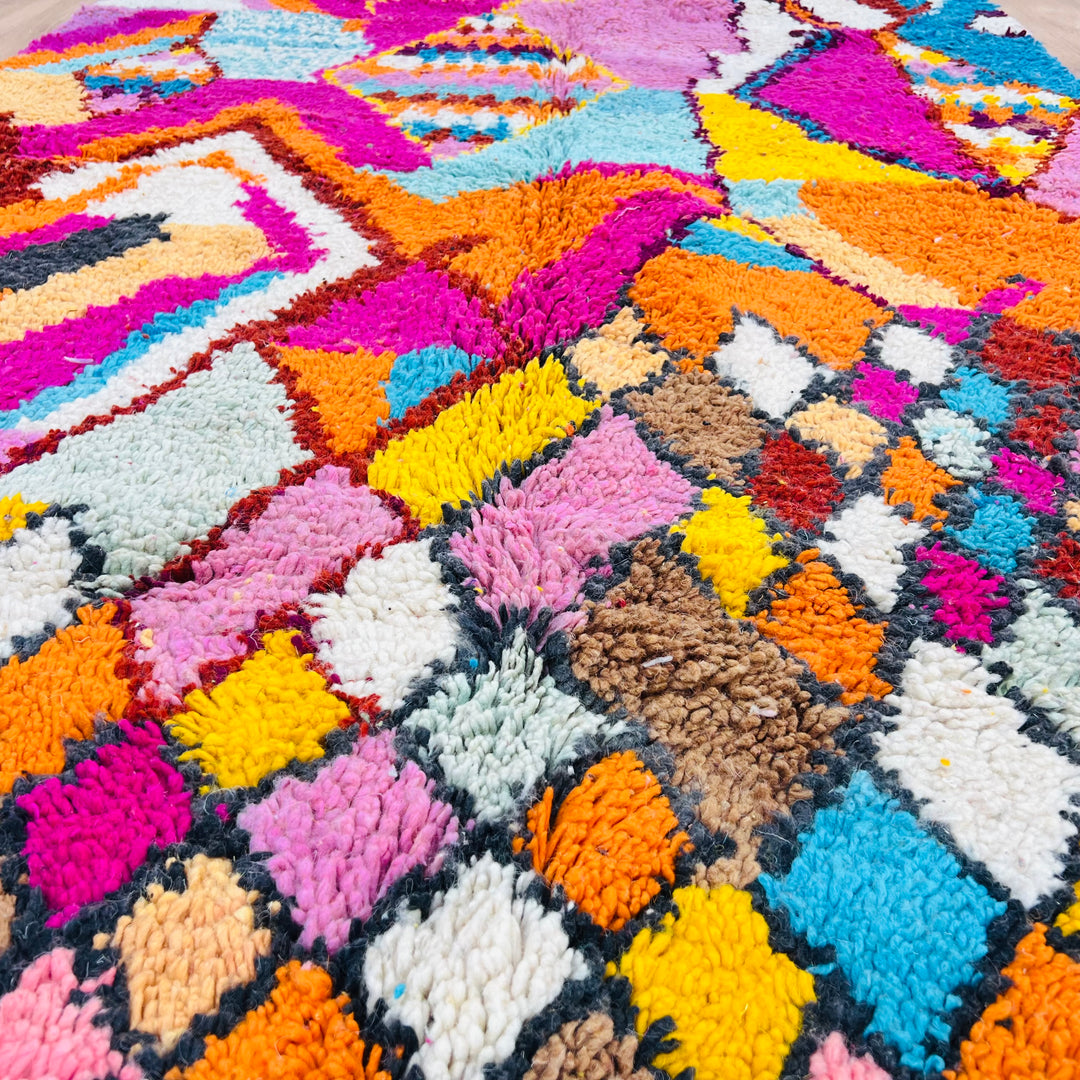 Colorful Moroccan Berber Rug with geometric patterns in vibrant pink, orange, turquoise, and yellow, 255x155 cm, handmade wool.