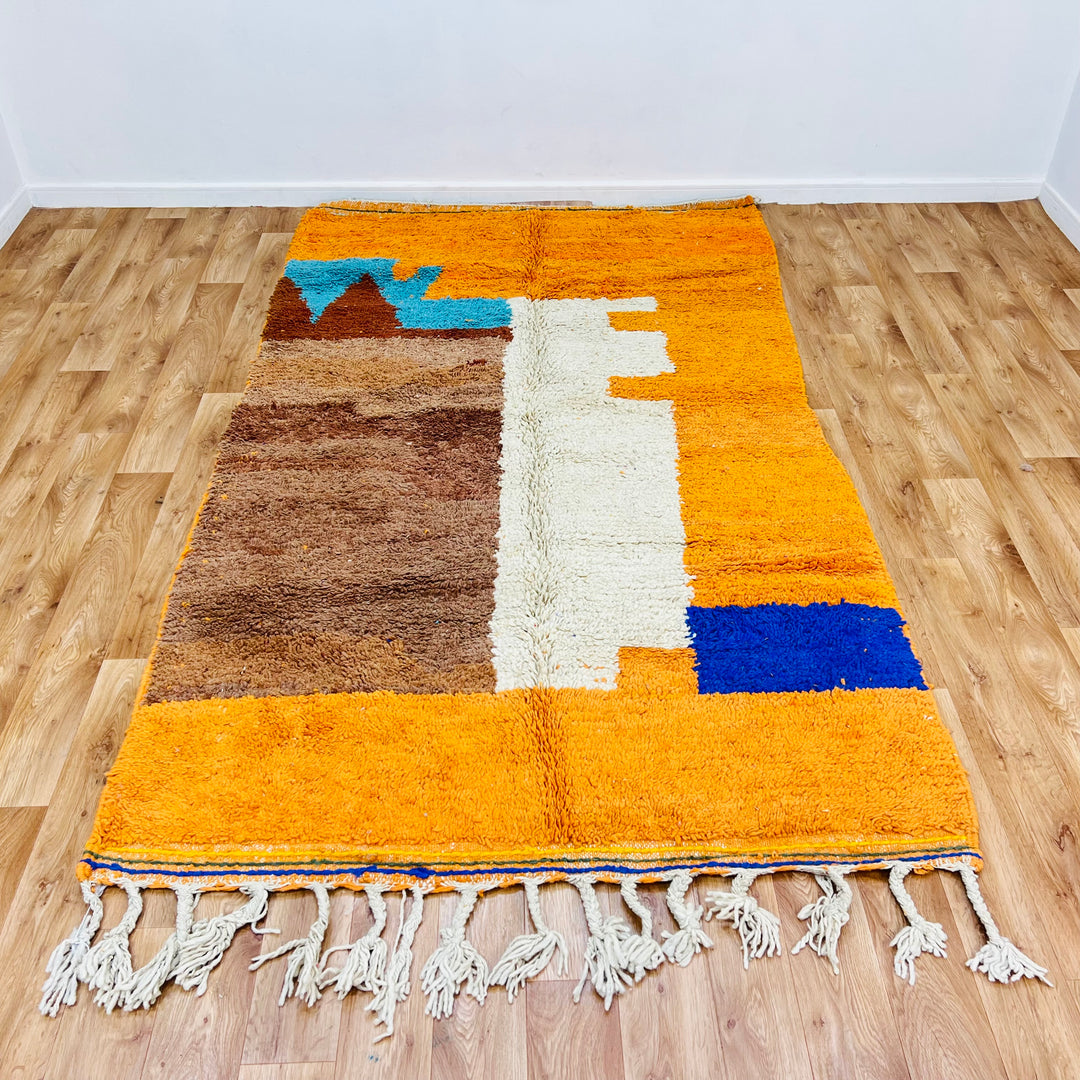 Vibrant handmade Moroccan wool rug with colorful abstract design, 251 × 157 cm, perfect for adding bold style to any room.