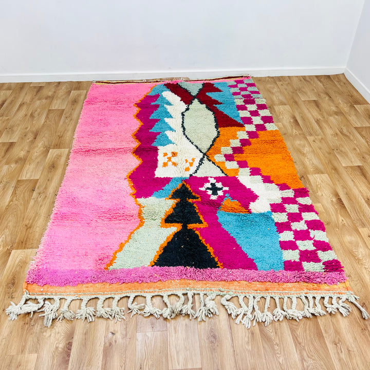Colorful vintage Moroccan wool rug with bold stripes in pink, red, yellow, aqua, and black, 255 × 157 cm, handmade by Berber artisans.