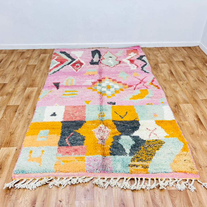 Vintage Pink Moroccan Rug with geometric symbols and tribal patterns, handmade by Berber women, 248 x 154 cm, traditional decor.