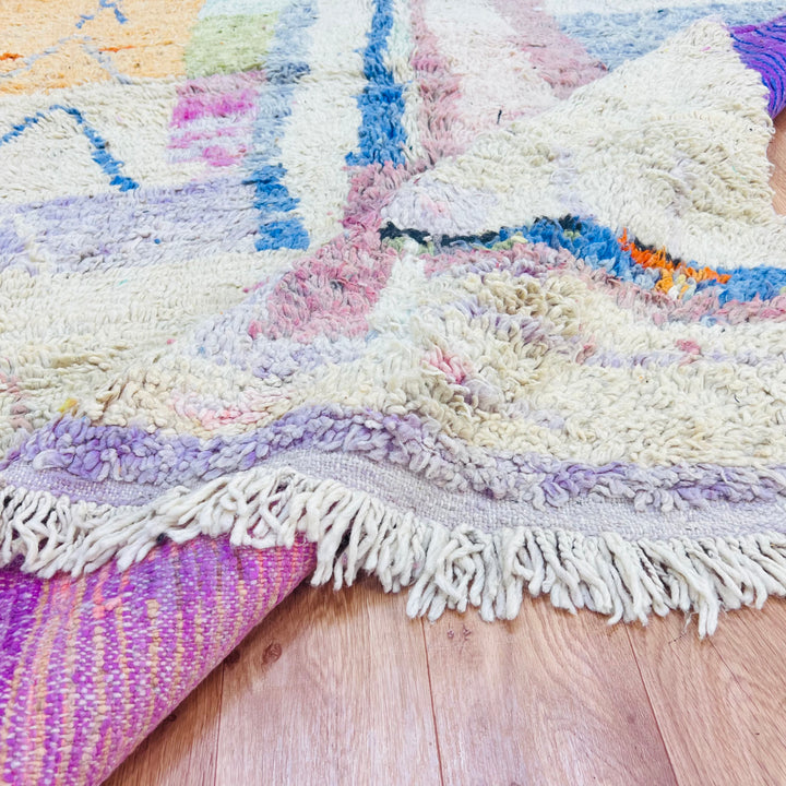 Pastel abstract Moroccan wool rug with colorful patterns and fringes, handmade by Berber artisans. Perfect for contemporary decor.