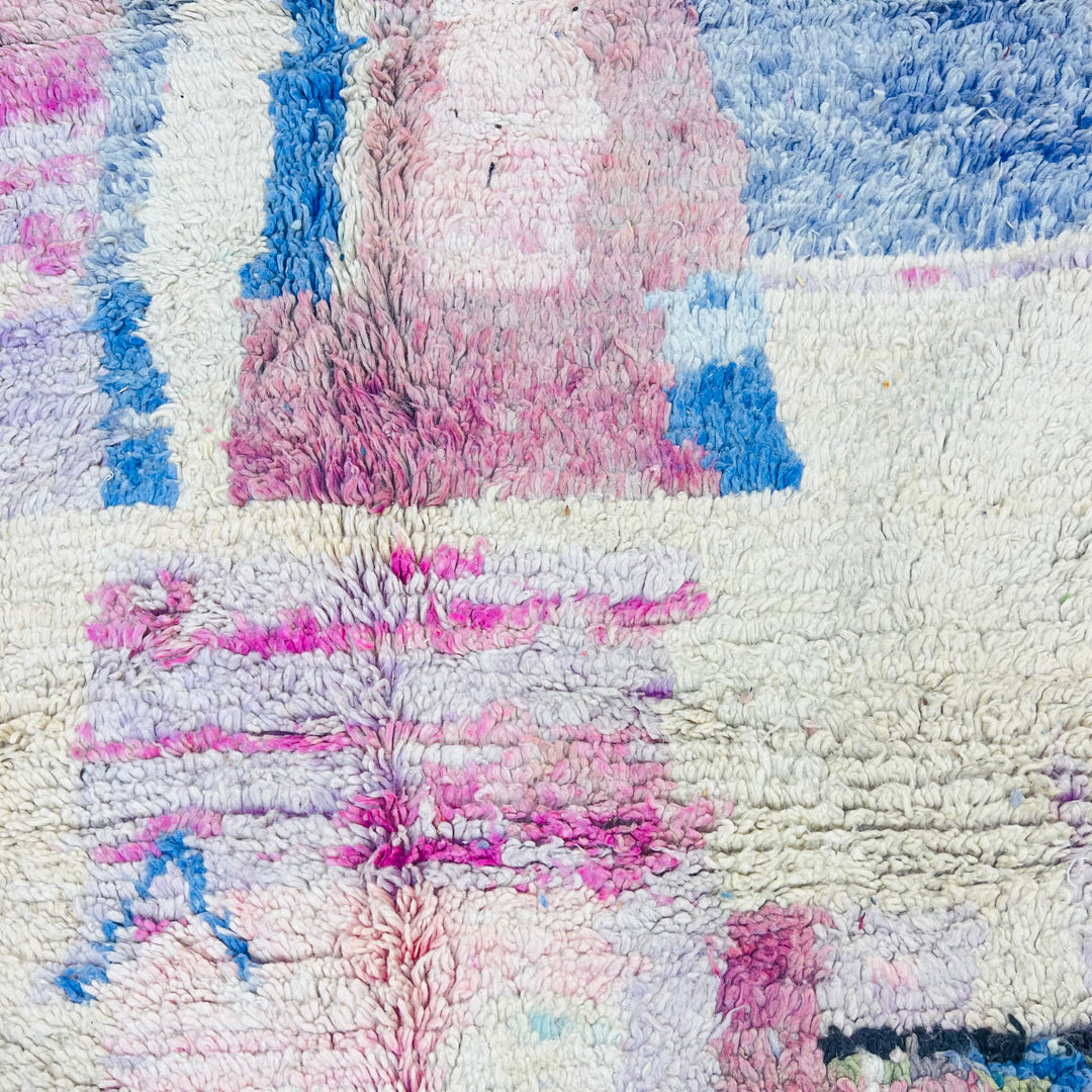 Pastel abstract Moroccan wool rug with blue, pink, and lavender hues, handmade by Berber artisans. Moroccan rugs for sale.