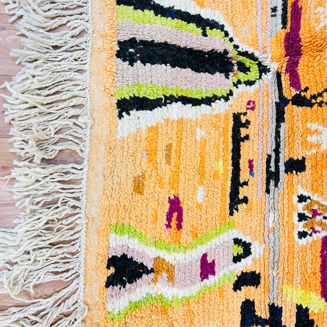 Diamond Tribal Moroccan Wool Rug with saffron, fuchsia, and green tones, handcrafted by Berber artisans, 278x151 cm.